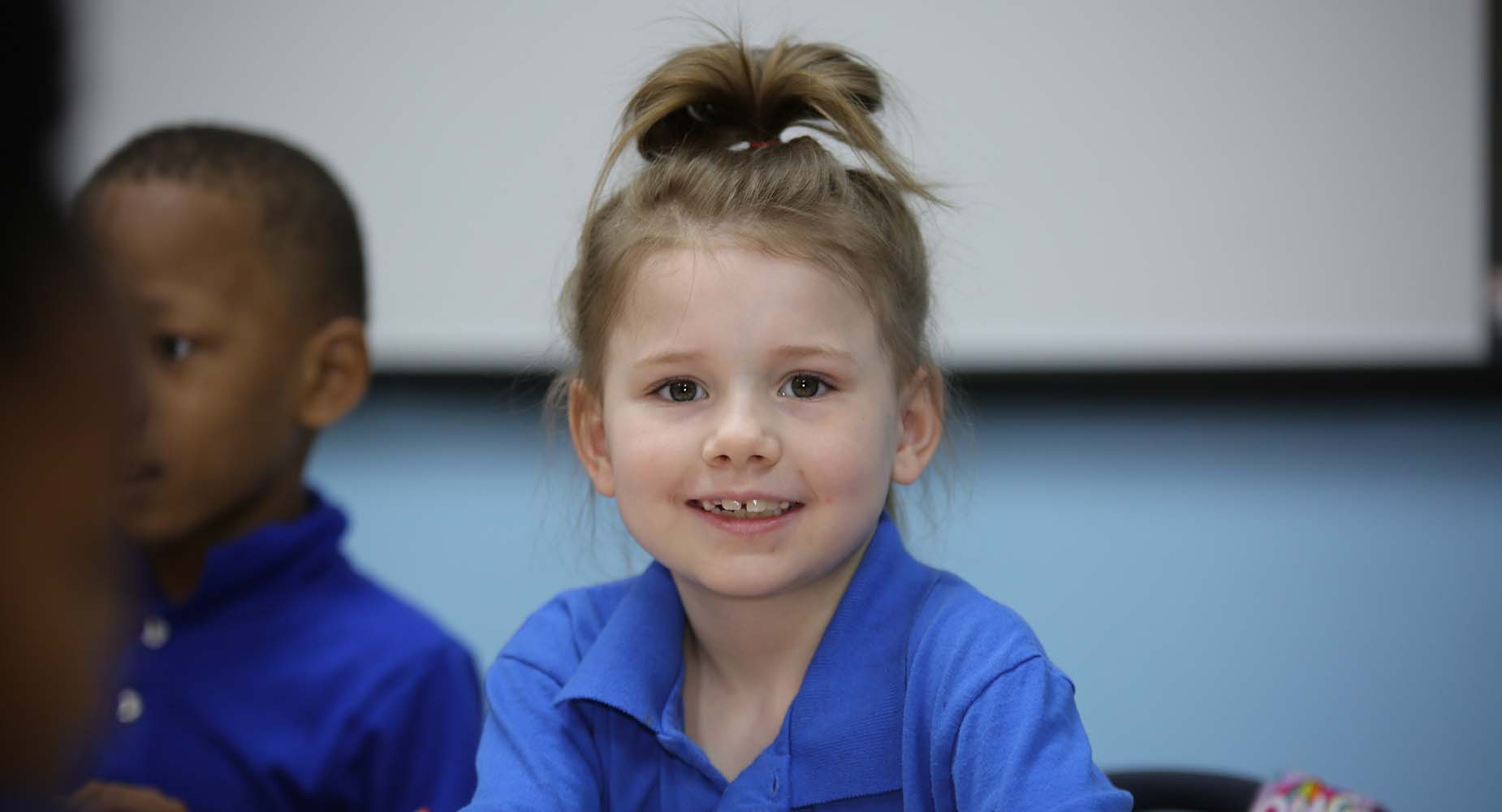 Teacher helping student