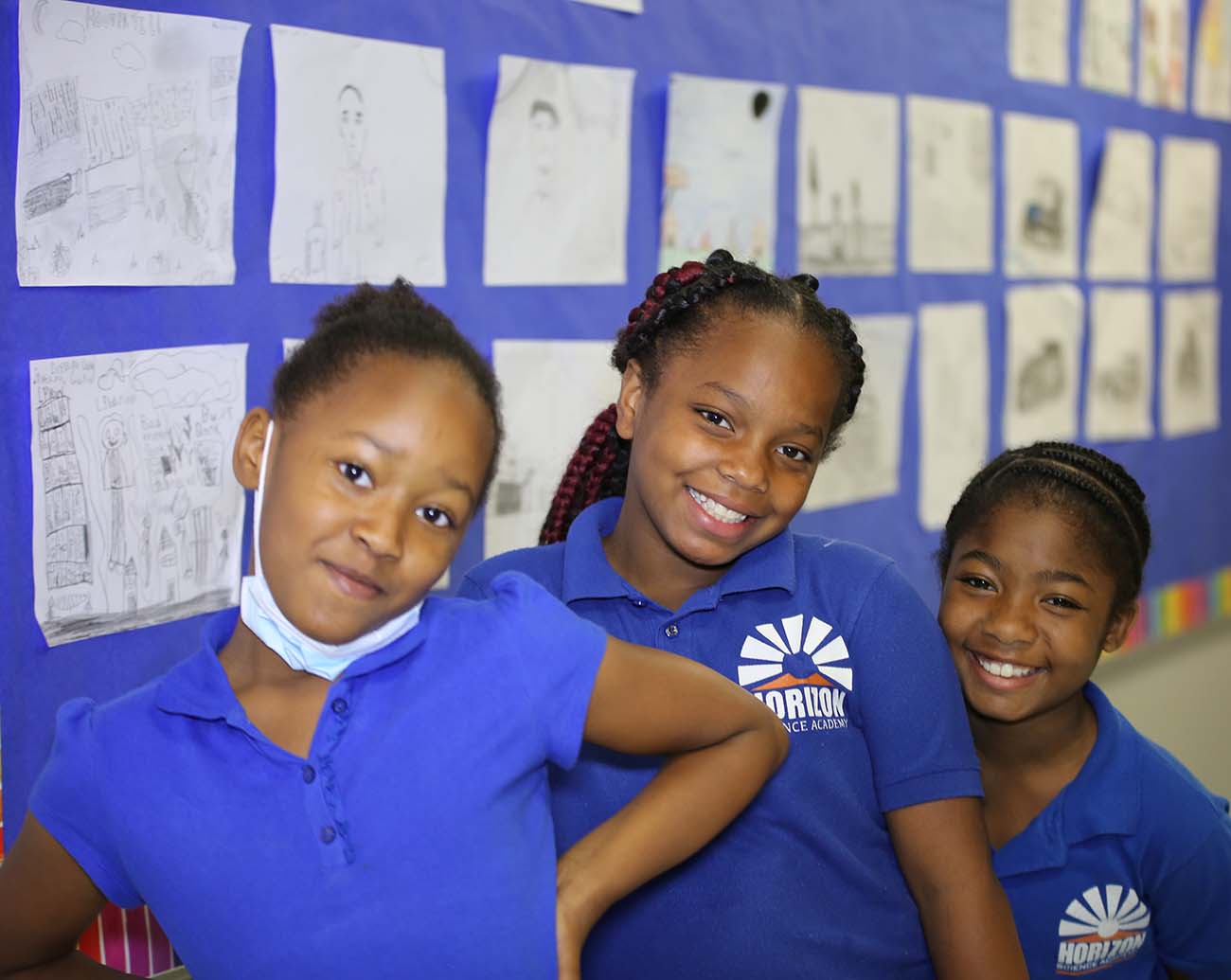 Teacher or school staff member warmly interacting with a student outside
